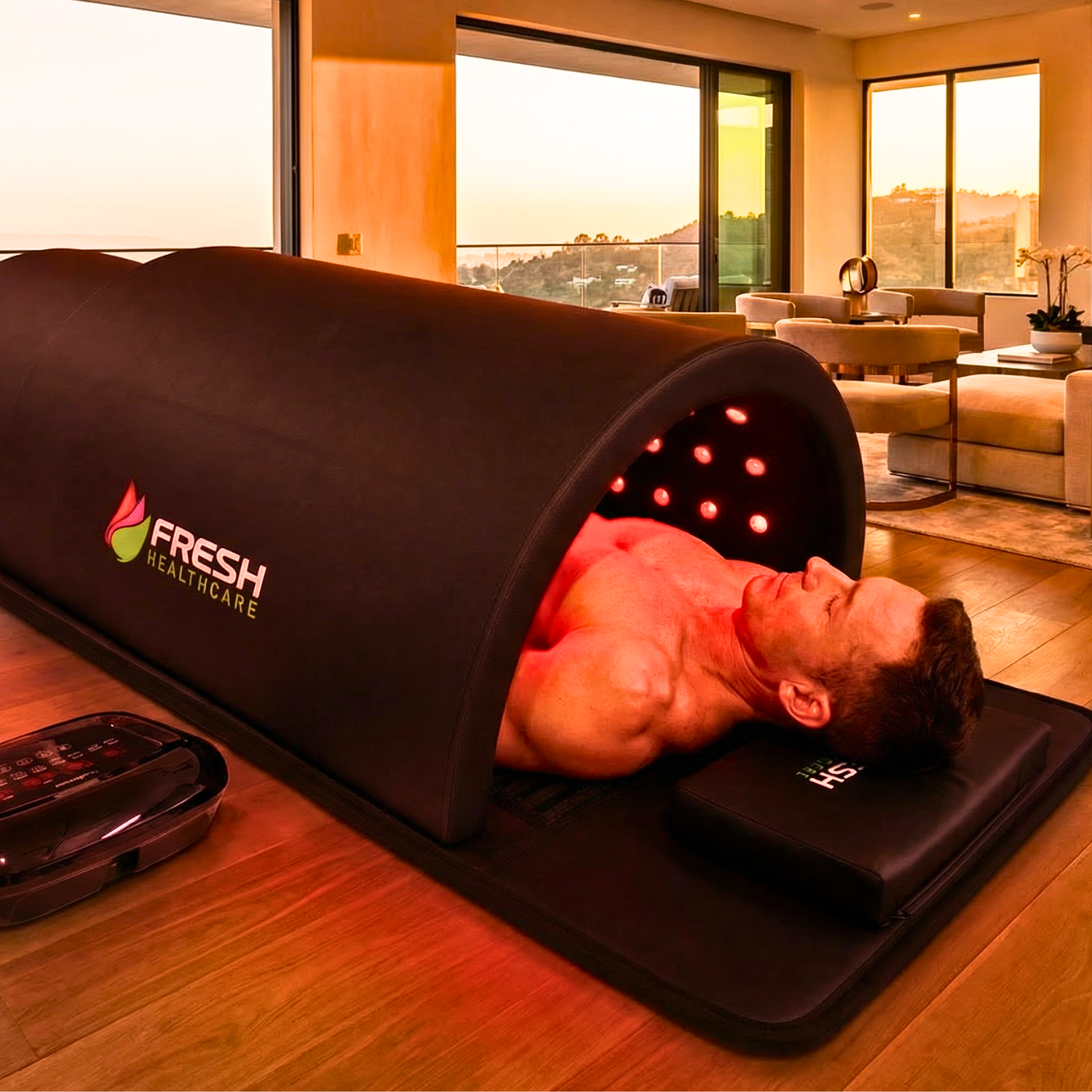 Man using Fresh Healthcare infrared PEMF sauna dome with red light therapy